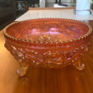 Iridescent carnival glass footed bowl embossed with roses